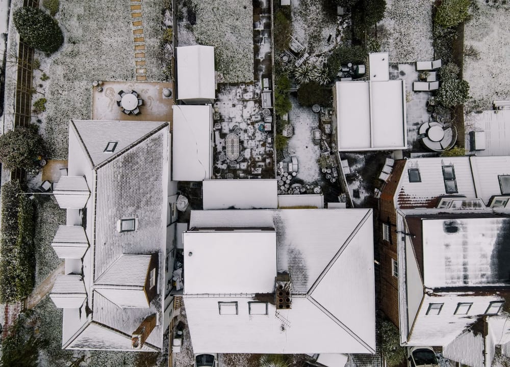 Rear gardens of a row of houses seen from above
